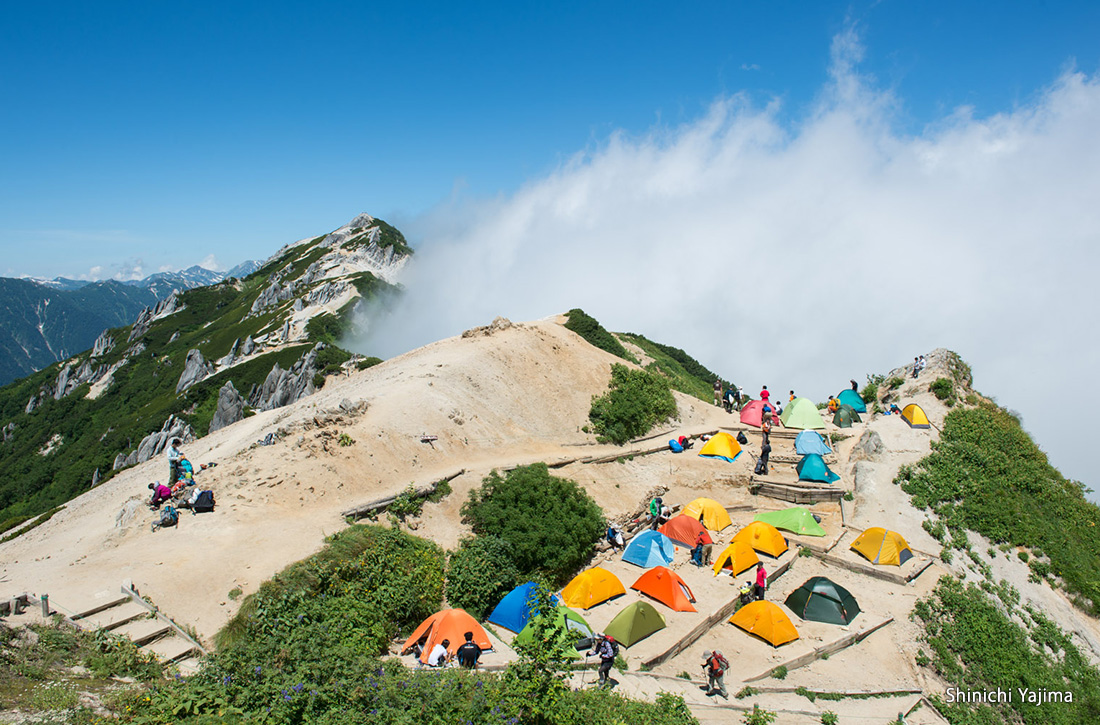 Mt. Tsubakuro and colorful tents during the summer.